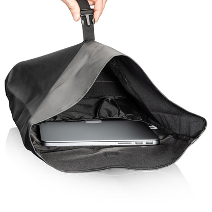 A laptop being held in a black bag